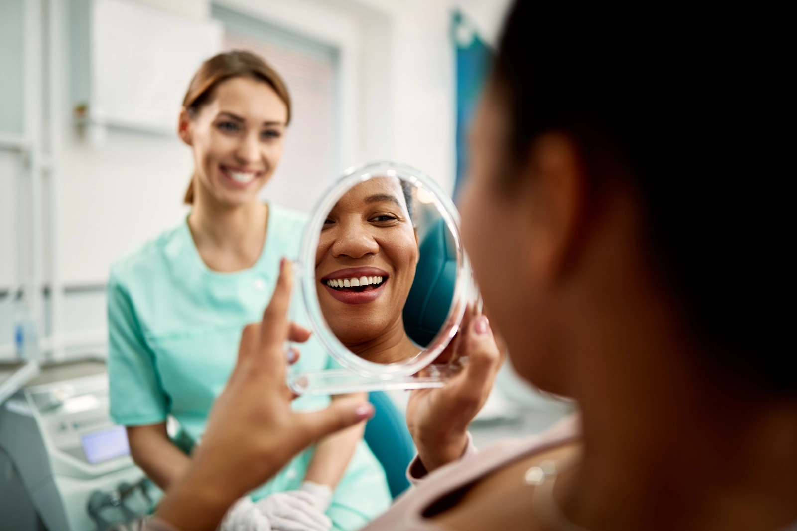 patient-smiling-mirror-Brava-hidden-braces